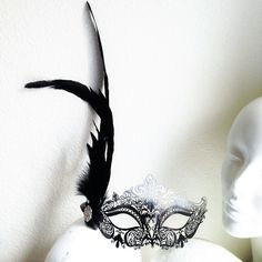 Stunning Silver Ombre Masquerade mask with high quality black feathers perfect for Masquerade Balls and more. S H I P P I N G - Processed same day or within 24 hours. 1-2 day guaranteed delivery services offered, add items to cart and click on shipping tab for rates. Pls leave a check out note with your need date & contact number (especially for expedited and custom orders) Msg for delivery time frames (Include your state/country). I N C L U D E D Mask comes with matching ribbons. S I Z E Ad Great Gatsby Costume, Mask With Feathers, Masquerade Mask Black, Elegant Face Mask, Black Masquerade, Masquerade Ball Masks, Black Masquerade Mask, Gatsby Costume, Metal Mask