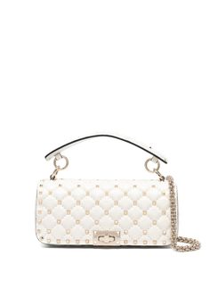 Rockstud Spike shoulder bag from VALENTINO GARAVANI featuring ivory white, calf leather, quilted, signature Rockstud detailing, spike stud detailing, internal logo stamp, main compartment, internal slip pocket, foldover top, twist-lock fastening, single flat top handle, detachable shoulder strap and detachable chain-link shoulder strap. Logo Stamp, Flats Top, Ivory White, White Bag, Valentino Garavani, Chain Link, Top Handle, Leather Shoulder Bag, Calf Leather