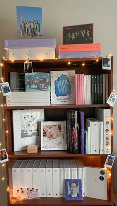 a book shelf filled with books and pictures