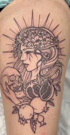 a woman with a skull and flowers on her thigh is shown in this tattoo design