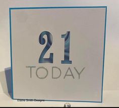 a white and blue sign with the number 21 today