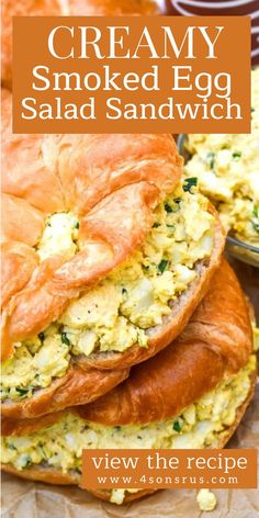 a close up of food on a plate with the words creamy smoked egg salad sandwich