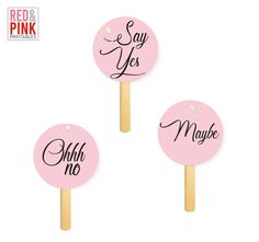 three pink lollipops with the words say yes and ohoh no on them