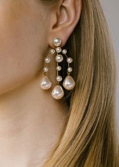 A mix of round and baroque-style pearls cascade gently from the luminous Dara Earrings. These regal chandelier earrings add some elegance to your look this holiday party season. We love pulling back our hair to really let these earrings shine. Discover more all new earrings. Dimensions: 2.75 inch length Round Pearl Earrings, Luxury Hair Accessories, Jennifer Behr, Hoop Earring Sets, Luxury Hair, Baroque Fashion, Bridal Fashion, Fine Jewelry Gift, Pearl Drop Earrings