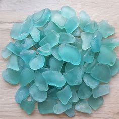 sea glass pieces on a wooden surface