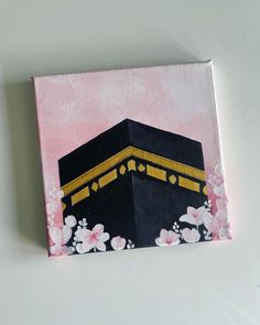 a painting of a black and gold building with flowers on it