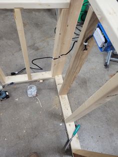 the tools are being used to build a wooden structure with plywood and screwdrivers