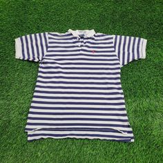 Vintage Ralph-Lauren Stripes Polo Shirt Medium 20x25 Blue Elevate your casual style with our vintage Ralph Lauren striped polo shirt in blue, medium, perfect for a classic retro look!  * Used condition  * Tag says XL measures as M-Short Athletic  * Length is on the shorter side  * No rips/holes  * No stains  * Normal fading from washing VINTAGE RALPH LAUREN POLO, STRIPED POLO SHIRT, MEDIUM POLO, BLUE POLO, VINTAGE CLOTHING, RETRO STYLE, CLASSIC POLO, RALPH LAUREN FASHION, 90S FASHION, CASUAL WEA Blue Polo T-shirt With Striped Collar, Navy Casual Polo Shirt With Striped Collar, Casual Striped Short Sleeve Polo Shirt, Striped Cotton Polo Shirt With Short Sleeves, Blue Polo Shirt With Striped Collar, Casual Blue T-shirt With Striped Collar, Striped Collared Cotton T-shirt, Classic Striped Collared Polo Shirt, Casual Striped Cotton Polo Shirt