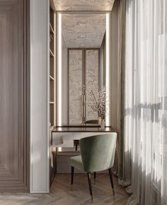 an elegant dressing room with a desk and chair in front of the mirror on the wall