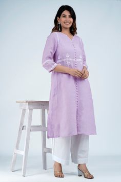 The very beautiful hand embroidered Linen-cotton tunic or kurta, available on demand (made to order) and customizable.Sizing: Please refer to our Size Chart to find your sizeThe item features55% Linen 45% CottonRound neck with wide V slitLong tunic for culottes, leggings or pants3/4 sleevesAverage length: 45 inLength of product may slightly vary as per the sizes. Please note: smaller size may be slightly shorter and bigger size may be slightly longer in lengthVarious colors availableMachine washable (Use mesh, Delicate cycle, Hang Dry)Delivery time: 4-6 weeksFor customization, please email us at info@ayurvastram.com Hand Embroidered Tunics, Tunic Kurti, Light Mauve, Cotton Tunic, Embroidered Linen, Embroidered Tunic, Shalwar Kameez, Designer Dresses Indian, Long Tunic