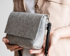 "Made of 100% natural merino wool felt. More Crossbody bags: https://www.etsy.com/shop/WoolberryBags?ref=seller-platform-mcnav&section_id=24034787 A universal accessory for any occasion, in any color you like. Yes, this bag fits more than you think! Your wallet, a 35mm camera, keys, makeup bag and a notebook - all this fits easily into one seemingly small clutch. DIMENSIONS: Width 23 cm (9 inches) Height 16 cm (6,3 inches) Thickness 5 cm (2 inches) The bag is handcrafted of natural German 10 Rectangular Felt Travel Bag, Daily Use Rectangular Felt Shoulder Bag, Rectangular Felt Bags As Gifts, Rectangular Felt Bags For Gifts, Rectangular Felt Shoulder Bag For Daily Use, Felt Clutch, Crossbody Bags For Women, Small Clutch, Felt Bag