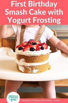 a baby sitting in a highchair with a cake on it and the words first birthday smash cake with yogurt frosting