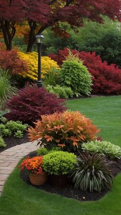 a garden filled with lots of different types of flowers and trees in the middle of it