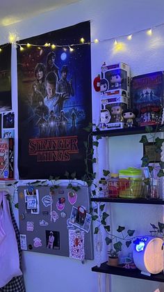 a room filled with posters and lights on the wall