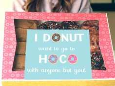 a woman holding up a box with donuts in it's front and the words i donut want to go to hoo with anyone but you