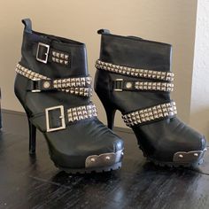 Hard To Find...These Are Beautifully Embellished Boots With Buckles...Rock ‘N’ Roll Style Feel. They Will Look Great With Jeans Or A Skirt For Your Night Out. Sold Originally For Over 500. Pour La Victoire, Jeannie, Women's Leather Ankle Boots, Studded, Black, Buckle Adjustment On The Ankle, Leather And Gunmetal Buckles And Studs, Around Toe With Metal And Studs In Front. High Heel Stiletto 4.5". Very Comfortable, Traction Platform Sole, Silver Metal Studs And Buckles. Leather Party Heels With Rivets, High Heel Moto Boots With Rivets For Party, Punk High Heel Moto Boots For Party, Punk Style High Heel Moto Boots For Parties, Edgy Moto Boots With Metal Feet For Parties, Edgy Ankle Boot Heels For Party, Party Black Moto Boots With Spikes, Edgy Party Ankle Boot Heels, Edgy Moto Boots With Rivets For Party