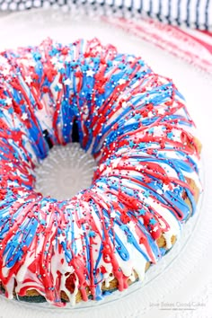 a bundt cake with red, white and blue sprinkles on it