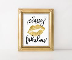 a gold framed photo with the words classy fabulous written on it in black ink