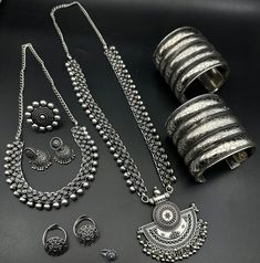 Luxury Oxidized Finish Temple Necklace For Festivals, Luxury Oxidized Temple Jewelry, Oxidized Chandbali Jewelry Sets, Heavy Silver Jewelry Sets For Navratri, Oxidized Finish Chandbali Jewelry Sets, Bohemian Jewelry Sets With Intricate Design, Oxidized Round Jewelry For Navratri, Silver Temple Jewelry Sets For Festivals, Bohemian Festive Gift Sets