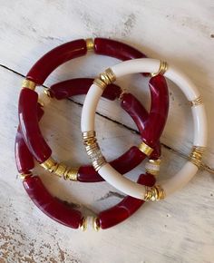 This gorgeous bracelet set will make you so happy this holiday season! It's a beautiful cranberry color with subtle white marble throughout. Accents of different types of gold plated spacers and white confetti Heishi. Ivory bangle with some glitter gold Heishi. So beautiful! This bracelet will run small. If you want them snug order your normal size. If you like them to be more of a bangle with movement then order half a size up. I wear a 6.5 I have average small wrists but like this in a size 7 Bangle Bracelets Gold, Tube Bead Bracelet, Holiday Bracelets, Tube Bracelet, Autumn Bracelet, White Confetti, Stackable Jewelry, Cranberry Color, Word Bracelet