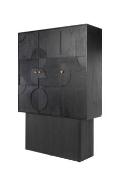 a black cabinet with two doors and three circles on the front, one door open