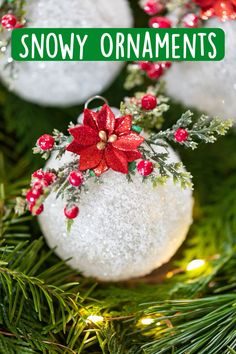 snow ornament hanging from a christmas tree