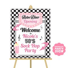 a welcome sign for someone's 50th birthday party with pink and black checkerboard