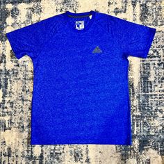 New Without Tags Men’s Adidas Ultimate Tee Size Large In Blue. In Perfect Condition, Non Smoking Home. Adidas Blue Sporty Shirt, Sporty Adidas Blue Shirt, Adidas Blue Crew Neck Top, Adidas Blue Short Sleeve T-shirt, Blue Adidas Crew Neck Top, Blue Moisture-wicking Short Sleeve Shirt, Blue Short Sleeve Sports Shirt, Adidas Blue, Blue Adidas