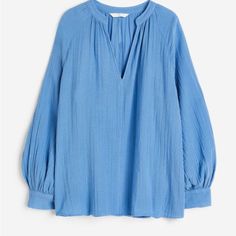 Loose-Fit Blouse In Double-Weave Cotton. Low Stand-Up Collar, V-Shaped Opening At Front, And Long, Raglan-Cut Balloon Sleeves With Button At Cuffs. H&m V-neck Tops For Daywear, H&m V-neck Blouse For Summer, H&m V-neck Summer Blouse, Blue H&m Top For Work, H&m Blue Workwear Top, Chic Blue Blouse From H&m, Chic Blue H&m Blouse, Chic Blue Blouse By H&m, H&m Relaxed Fit Spring Blouse