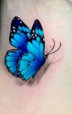 a blue butterfly on the back of a woman's neck