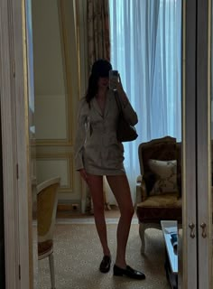 a woman taking a selfie in a hotel room