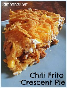 a close up of a piece of food on a plate with the words chilli frito crescent pie