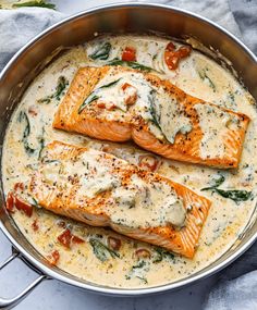 two salmon fillets in a creamy sauce