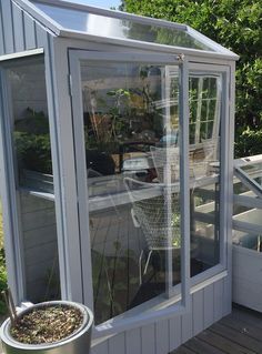 a patio with a table and chairs in it