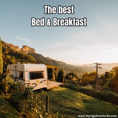 the best bed and breakfast trailer parked in front of a mountain with mountains behind it