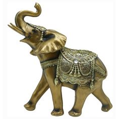 an elephant figurine is adorned with jewels