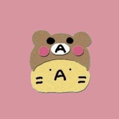 a brown teddy bear with the letter a on it's face