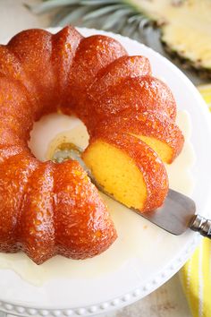 a bundt cake on a plate with a knife