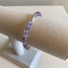 New Handmade Semi-Precious Stone Beaded Bracelet. Made Of 6mm Purple, White, Clear Color Amethyst Stone Beads And 4 Mm Sterling Sliver Plated Rounds. Hand Strung On Jewelry Wire For Strength, Lobster Clasp. Bracelet Is Approximately 7" With A 2" Extension Chain. I Can Add Or Adjust Chain Length If Needed. From A Smoke-Free Home. Amethyst Beaded Bracelet, Amethyst Bracelet Beads, Clasp Bracelet, Jewelry Wire, Amethyst Beads, Women Artisans, Amethyst Stone, Adjustable Bracelet, Bead Bracelet