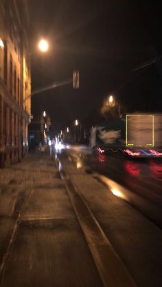 blurry photograph of city street at night