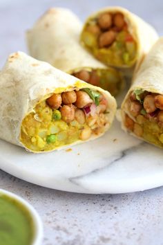 there is a burrito with beans on it