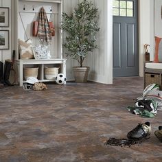 a living room filled with furniture and lots of clutter on top of the floor