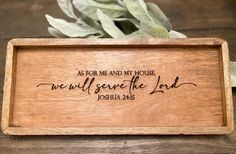 a wooden plaque with the words as for me and my house we will serve the lord