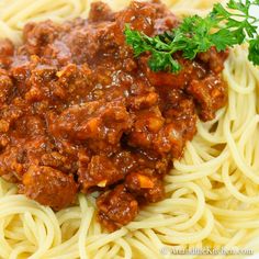 spaghetti with meat sauce and parsley on top