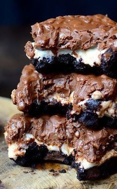 chocolate and marshmallow ice cream sandwich cookies stacked on top of eachother