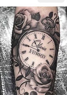 an arm with a clock and roses on it