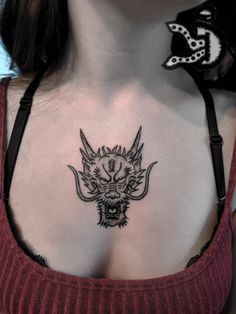 a woman with a tattoo on her chest