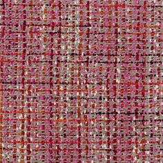 an orange and pink tweed fabric with small squares