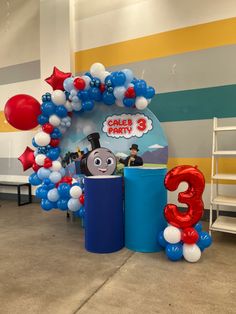 a train themed birthday party with balloons and decorations