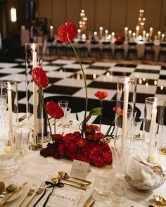 Embrace the 'Unexpected Red Theory' to add flair and energy to your wedding décor with bold red accents that create a memorable statement. Black And White Wedding Pop Of Red, Modern Red Centerpieces, Beautiful Centerpieces Wedding, Red White And Black Flower Arrangements, Jazz Club Wedding Theme, Red Black White Gold Wedding Decor, Black White And Red Party Decorations, Black Red White Wedding Decorations, White Black Red Wedding